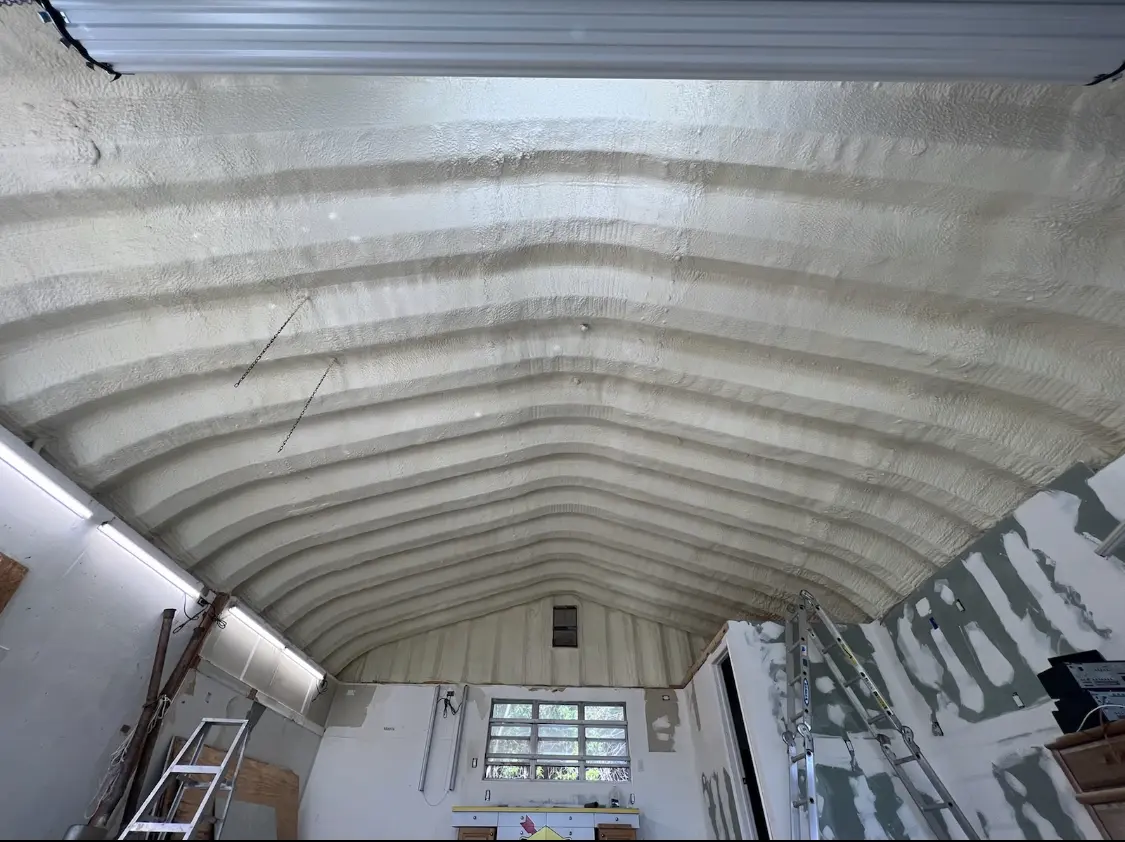 Spray polyurethane foam applied to the underside of a metal roof deck in Littleton